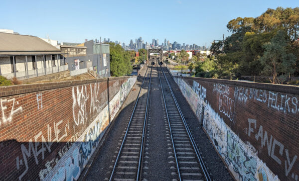 Looking down train tracks toward city